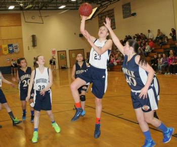 Faith Blethen puts up a running shot for two of her nine points against Medomak in the seventh grade semifinal game at BRES on Thursday, Jan. 23. Boothbay won easily, 47-22. KEVIN BURNHAM/Boothbay Register Blethen