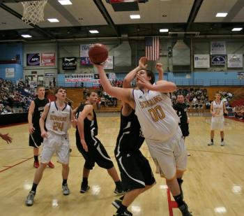 Senior center Shawn Simmons attempts a shot late in Monday’s game against Hall-Dale at the Augusta Civic Center. KEVIN BURNHAM/Boothbay Register Simmons