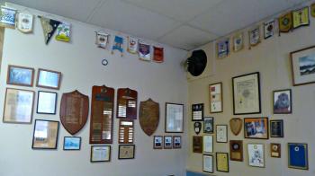 A wall of history inside the club, plaques of members, flags of other clubhouses, photos and article chronicle the history of the Boothbay Lions and the clubhouse. KATRINA CLARK/Boothbay Register