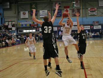 Senior captain Andrew Hallinan puts up a running shot against Hall-Dale during the first half of Monday’s Class C quarterfinal tournament game at the Augusta Civic Center. KEVIN BURNHAM/Boothbay Register Hallinan
