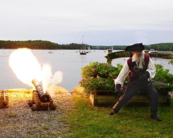 Artillery: A Dark Rose Pirate sends fire downrange while defending the in-town areas of Damariscotta and Newcastle during a past Damariscotta River Pirate Rendezvous. Members of the group can learn to operate a variety of period weapons. Courtesy of Don Dunbar/easternmaineimages.com