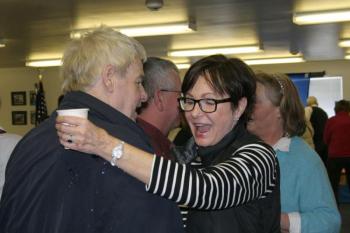 Pam Heino Aloupis hugs Howie Barter after his arrival. KEVIN BURNHAM/Boothbay Register