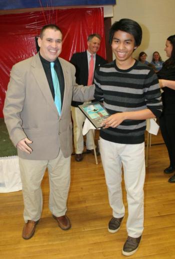 Karl Alamo receives one of the two Youth of the Year awards from Y Recreation Director Ed Crocker. KEVIN BURNHAM/Boothbay Register Alamo