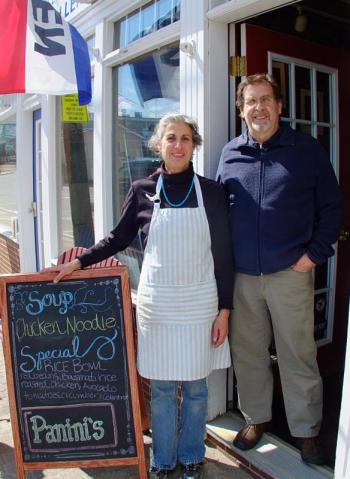 WENDY AND PAUL JOHNSON welcoming patrons to their coffee house, The Red Cup. SUZI THAYER/Boothbay Register