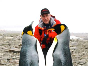 Bob Healing with King Penguins in the south Atlantic. Healing, a member of the Bigelow Laboratory for Ocean Sciences Board of Trustees, will discuss the groundbreaking research the lab is doing on climate change and ocean acidification at St. Andrews Village on May 15. Courtesy of Bigelow Laboratory