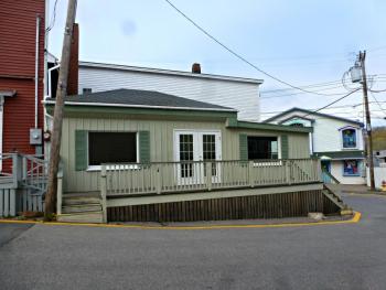 The current Windjammer Shop at 8 Wharf Street includes both the wooden building and the white building seen behind. KATRINA CLARK/Boothbay Register