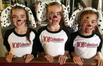 Three puppies (Madison Phelps, Molly Shook, and Brynna Nelson) wait for showtime! Courtesy of Emily Mirabile