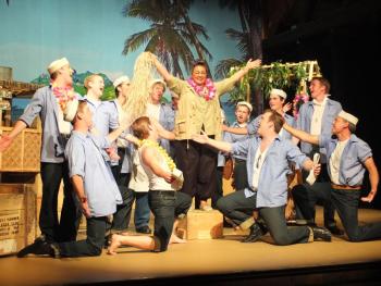 Bloody Mary (Emile Mirabile) entertains members of the U.S. Navy's enlisted in a scene from the Boothbay Playhouse production of "South Pacific." LISA KRISTOFF/Boothbay Register