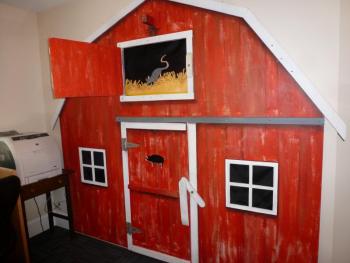 A fun display on the wall in the children's room. Open the upper hatch to find a rat in the hay! What's behind the lower hatch? KATRINA CLARK/Boothbay Register