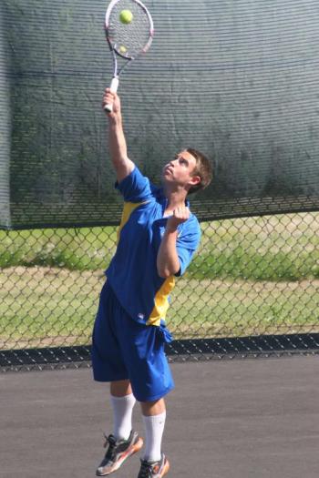 First doubles player Collin Thompson serves in Tuesday’s match. KEVIN BURNHAM/Boothbay Register