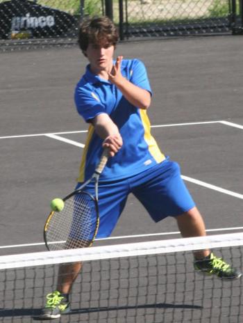 First doubles player Ben Betts attempts a drop shot at the net on Tuesday against Waynflete. KEVIN BURNHAM/Boothbay Register