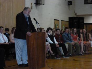 Principal Mark Tess welcomes the audience to the eighth grade graduation ceremony. KATRINA CLARK/Boothbay Register