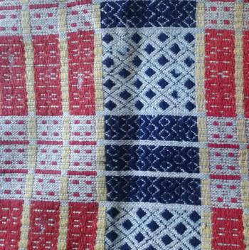 An early 19th century overshot coverlet on loan to the Lincoln County Historical Association from the Ulrich Plunkett collection. CASEY HOUSER/Boothbay Register