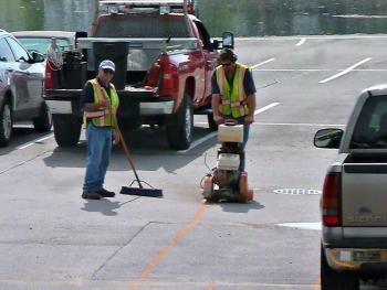 Two members of the Public Works crew in the footbridge parking lot. KATRINA CLARK/Boothbay Register