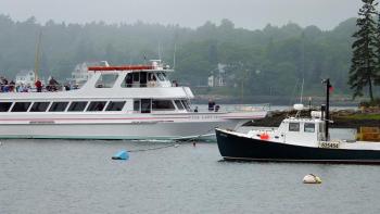 THE PINK LADY comes back into the harbor after a tour in the waters off Boothbay Harbor. Judging by the jackets on many of the passengers, it was cooler out on the ocean than in the harbor on July 3. SUZI THAYER/Boothbay Register