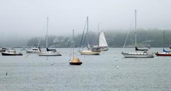 A SCHOONER raises its sails as it sails out of the harbor on a cool breeze on July 3. SUZI THAYER/Boothbay Register