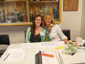 Volunteers Liz McIlwain, left, and Sheri Jones, right, man the registration table. KATRINA CLARK/Boothbay Register