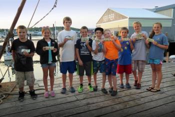 The winners of the Boothbay Region Fish and Game Association (youth division mackerel and pollock categories) show off their winnings. Courtesy of Steve Rubicam