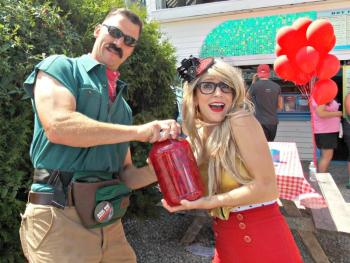 “Man Hand Strength” Police Chief Bob Hasch lends a hand to “Waffle Girl” Anya Heyl to open a jar of maraschino cherries during the Wannawaf Charity Waffle Eating Contest. KATRINA CLARK/Boothbay Register