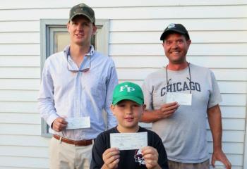 This year’s Boothbay Region Fish and Game Association tournament striper winners: Mike Bobrowiecki, front row, took first with a 24 3/4” catch; Kevin Stevens, right, took second with a 24 1/2” catch, and Ray Rubicam took third, with a 24” catch. There were no bluefish entries this year. Courtesy of Steve Rubicam