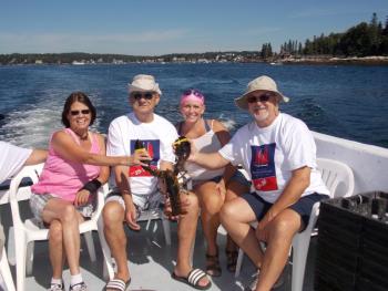 Holding a fresh lobster caught by captain Rusty Court on his boat, Casey Anne. From left are veteran Kathleen Lyons, Pat Howes, veteran Jen Howes, and Al Fornier. KATRINA CLARK/Boothbay Register