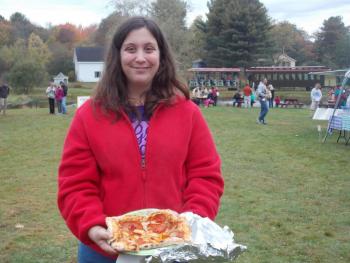 Jamie Sprague of Wiscasset ordered a pizza from the Crust pizza tent at the Fall Foliage Fair. KATRINA CLARK/Boothbay Register