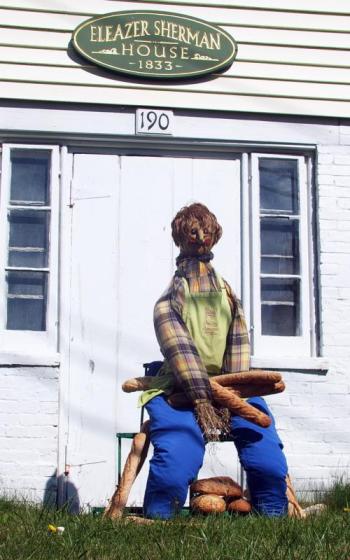 A baker displays his loaves of bread in front of the Eleazer Sherman House, where Kim Martin and Denise Demeter of Eventide live. SUZI THAYER/Boothbay Register