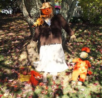 Liz Bridges’ front yard features a scarecrow display of a grandmother and grandchild called “Grandma House.” SUZI THAYER/Boothbay Register