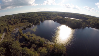 The southern end of Adams Pond as seen from the Boothbay Region Community Television drone camera. A watershed consists of all the land that drains into a lake, pond or river. Human activities and development in a watershed can have a large impact on water quality and aquatic communities. The Adams Pond and Knickerbocker Lake Watersheds Survey Report is now available. Courtesy of Jonne Trees/BRCTV Photo of Adams Pond