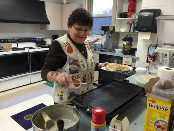 YMCA Administrative Assistant Doris Welch prepared pancakes for the Active Older Adults Thanksgiving breakfast at the YMCA on Nov. 17. SUZI THAYER/Boothbay Register