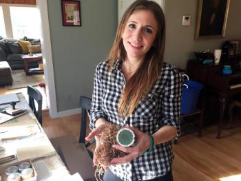 Anya Heyl, in her Edgecomb home/workshop, holds some of her Pine Cone Fire Starters. SUZI THAYER/Boothbay Register