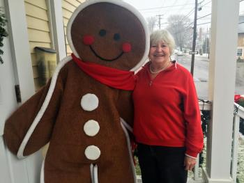The gingerbread “man” and his handler, Joanne Platt, take a breather outside the Opera House on Saturday, Dec. 14. SUZI THAYER/Boothbay Register