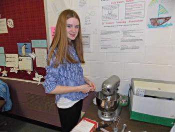Freshman Sarah Foley works on creating a cake in the “Cake Decorating” elective taught by Melissa Burgess. KATRINA CLARK/Wiscasset Newspaper