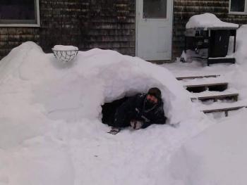 Tom Dewey in the snow fort he built at home. Co-worker Leisha MacDougall asked why he built it since his son isn’t even home. Dewey said: “My son is in college — and besides, why does he have to be home?” Courtesy of Tom Dewey