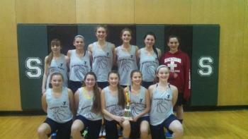 The Boothbay Region YMCA seventh and eighth grade girls travel basketball team holds the championship trophy at the Spruce Mountain tournament on Sunday, Feb. 8. Pictured from left are, front row: Katie Larson, Maddy Faulkingham, Chloe Arsenault, Maisy O’Brien, Josey Smith; back row: Ashley Abbott, Maggie Larson, Faith Blethen, Helen Hamblett, Hannah Gentry and Alexis Davison. Courtesy of Lesley Blethen