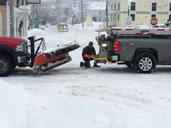 On Thursday morning, Feb. 5, on top of all the other frustrations due to one snowstorm after another during the past two weeks, a Boothbay Harbor Public Works vehicle broke down on the intersection of Townsend Ave. and Union Street. Here, one public works employee hooks his truck up to another public works truck to be towed to the Good ‘N You garage across the street. In the distance more trucks, mostly with plows, can be seen heading down Townsend Avenue. SUZI THAYER/Boothbay Register