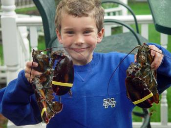 Matt Burnham, at six, shows off his first catch: two big ones! Lisa Burnham photo