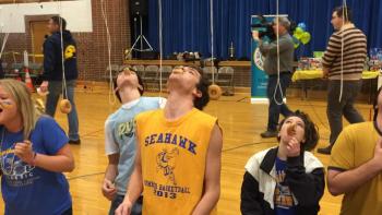 Matthew Burnham fights to the finish in the donut-on-a-string contest. KATRINA CLARK/Boothbay Register