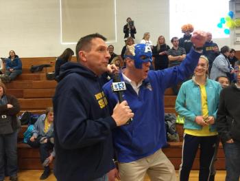 It wasn't just students showing their spirit at Boothbay Region High School on Friday morning. Jeff Peterson of WGME, left, gets a rousing cheer from local parent Brian Blethen dressed as Captain America. KATRINA CLARK/Boothbay Register