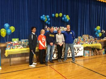 Over 20,000 pounds of food was collected by Boothbay Region High School. From left: Student body president Karl Alamo, Becky Wright from the Good Shepherd Food Bank, Jeff Peterson from WGME, Lauren Reeves representing the Maine Credit Unions, and Principal Dan Welch. KATRINA CLARK/Boothbay Register