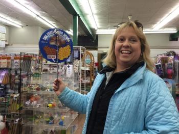 Sarah Morley holds up one of her Cash Mob finds — an extendable spork for stealing food off other people's plates. It was a huge hit as a birthday present for her nephew, Luke Morley, that evening. KATRINA CLARK/Boothbay Register