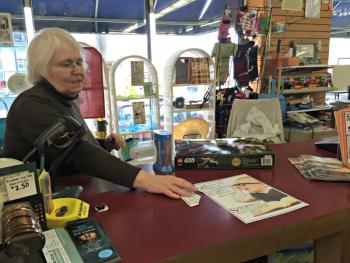 Suzanne Raudenbush collects the Cash Mob ticket from a customer. KATRINA CLARK/Boothbay Register