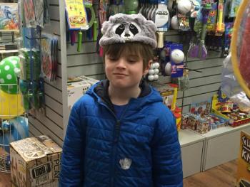 Brennan Wright seems a little unimpressed by the coonskin cap. KATRINA CLARK/Boothbay Register