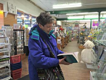 Sue Hartgrove looks at the Easter goodies at Sherman's during the cash mob while her husband, Dane, shops upstairs.