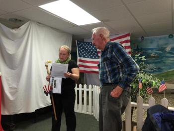 Amylynn Balsdon, left, presents a cane to her father-in-law Charles Balsdon. KATRINA CLARK/Boothbay Register