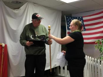 Amylynn Balsdon, right, presents a cane to Archie Brewer of Wiscasset. KATRINA CLARK/Boothbay Register