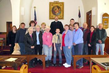 Participating in the mock trial at Southport Methodist Church on March 14 are, from left, back row: Kristi Poole (police officer), Joel Peaslee (former friend of the defendant), Jake Brewer (defendant), Draco Peaslee (defense attorney), Judge Charles Dow, Jacob Bishopp (prosecuting attorney for the state of Maine); front row: Ziggy (Troop 238 mascot), Troop Grandmothers Jean "Nini" Thompson, Evelyn "Mema" Sherman, and Nora "Grammy" Brewer (jurors); Ethan Barter (witness), Bonnie Wormwood, Tammy Blackman, Becky Singer, Jim Singer (jurors); Meegan Burbank (Attorney and merit badge counselor), Attorney Richard Elliott Sr. (Troop 238 mentor, juror and Eagle Scout). Missing from the photo was Sarah Sherman (Scoutmaster and juror). Courtesy of Sarah Sherman