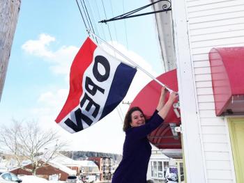 Stacey McLellan got teary-eyed on March 2 when she talked about the first time she hung her “Open” sign at her new business a year ago. SUZI THAYER/Boothbay Register