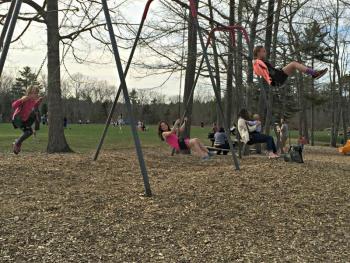 Students playing on the swing set at the ice cream social. KATRINA CLARK/Boothbay Register