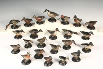 Set of 23 carved wood miniature duck decoys by A. E. Crowell. Courtesy photo
